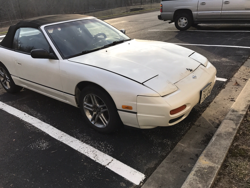 One slightly damaged 240SX, courtesy of a run-in with a Jeep Commander. Of course Cox is going to fix it.